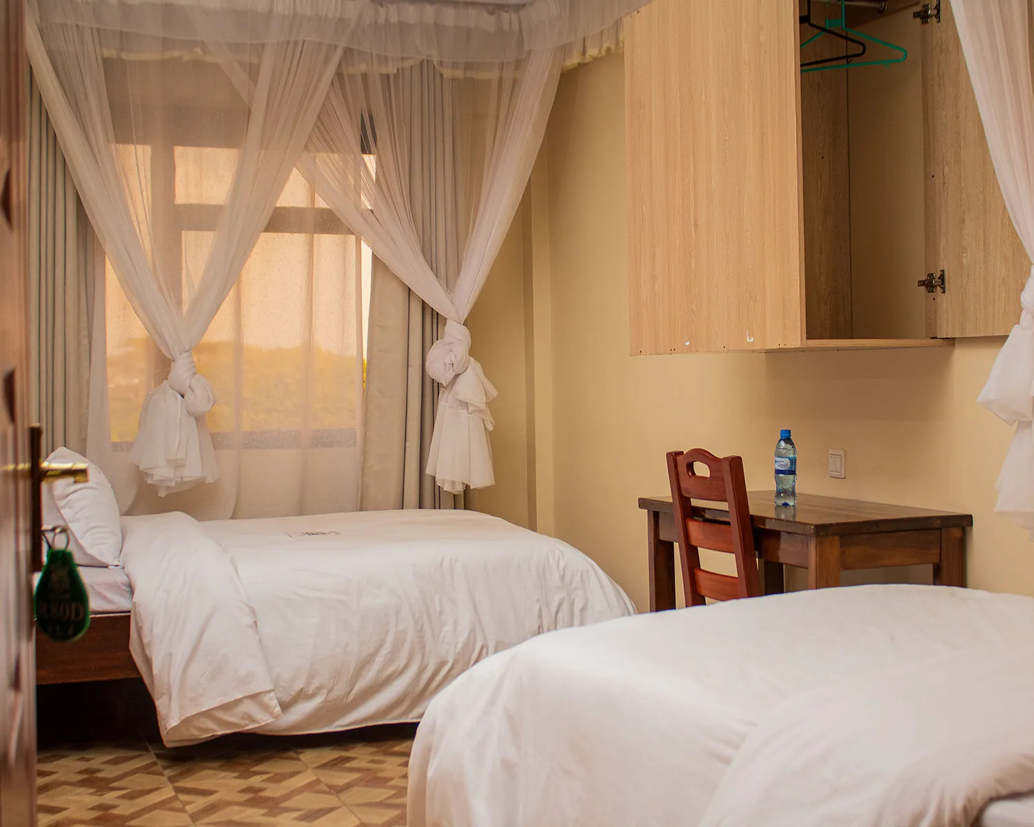 Comfortable twin guest room at Amani Centre