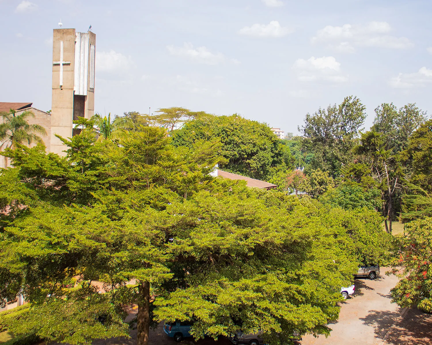 Amani Centre chapel tower among lush trees